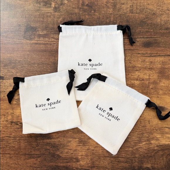 kate spade Accessories - Kate Spade Cream Pouches with Black Ties